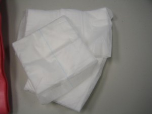 Use any sterile absorbent cloth to control bleeding due to shark bites