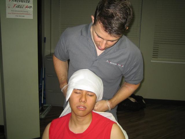 Head-Injuries-Applying-Gauze-Dressing-and-Bandage-to-Wound